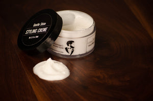 A tub of white hair styling cream